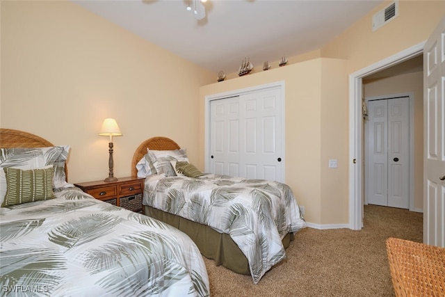 bedroom with carpet floors, ceiling fan, and a closet