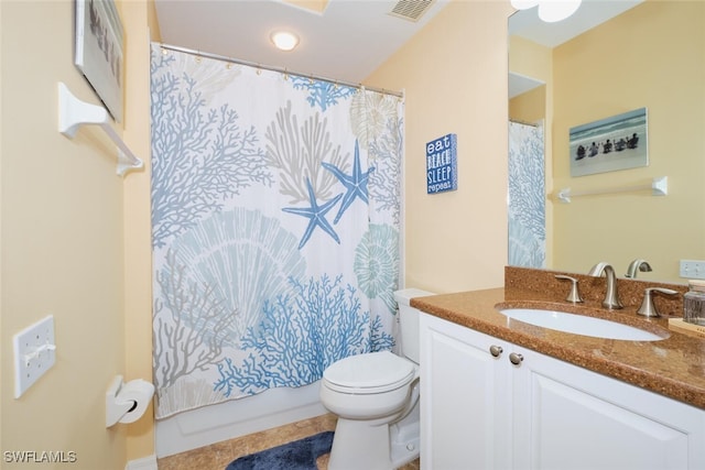 bathroom with vanity, toilet, and walk in shower