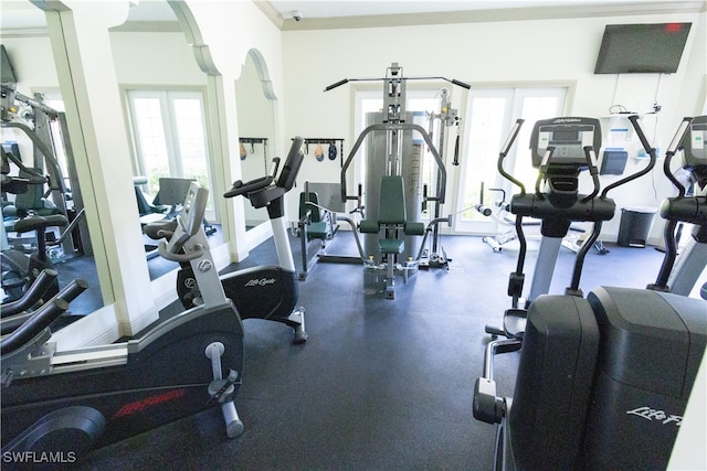 exercise room with ornamental molding