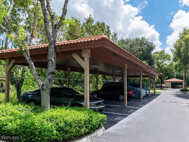 view of vehicle parking featuring a carport