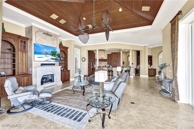 living room featuring wood ceiling, crown molding, a raised ceiling, and a premium fireplace