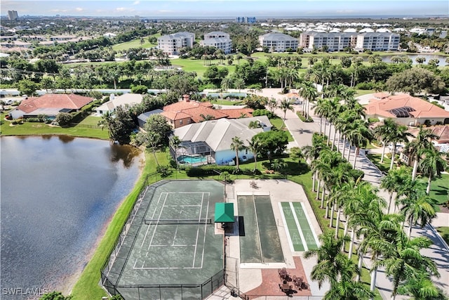 birds eye view of property with a water view