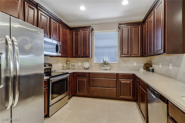 kitchen featuring stainless steel appliances, light tile patterned floors, light countertops, and tasteful backsplash