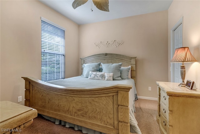 bedroom featuring ceiling fan, carpet, and baseboards