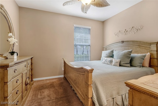 carpeted bedroom featuring a ceiling fan and baseboards