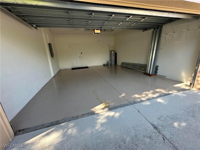 garage with a garage door opener and water heater