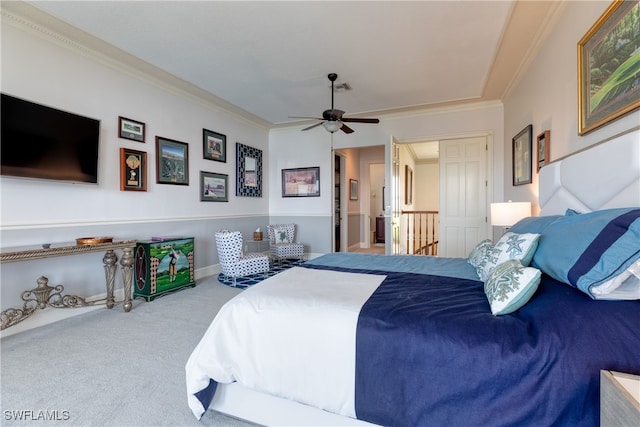 bedroom featuring ceiling fan, ornamental molding, carpet floors, and ensuite bathroom