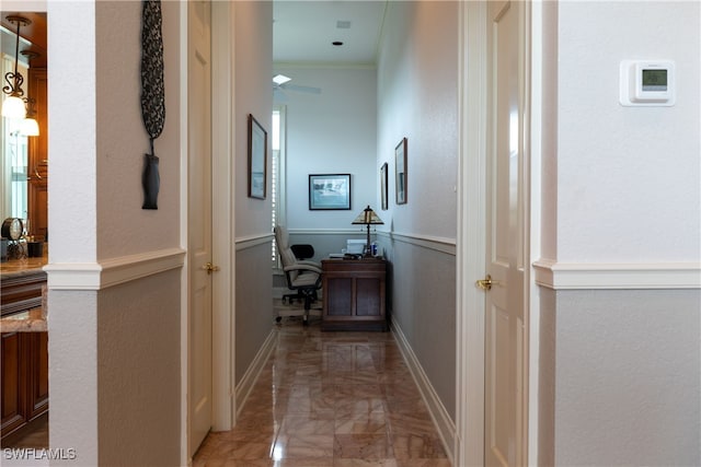 hallway featuring crown molding