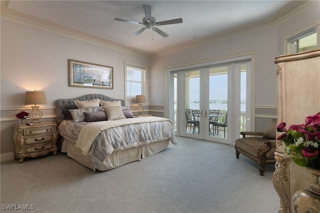 carpeted bedroom featuring crown molding, access to exterior, ceiling fan, and french doors