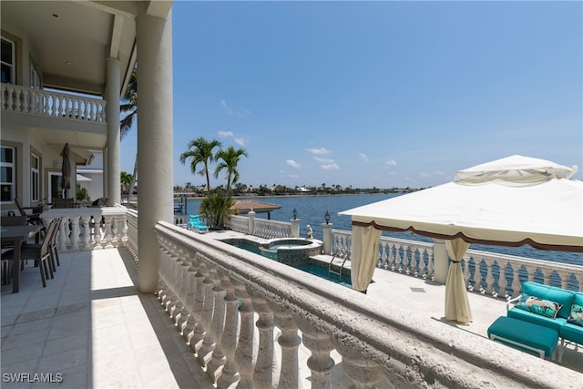 balcony featuring a water view