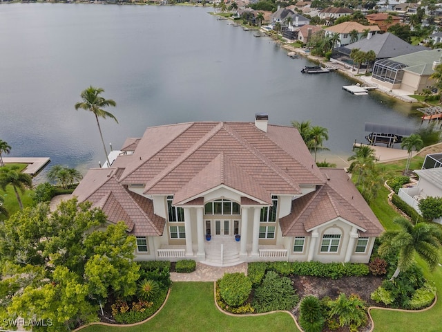 birds eye view of property with a water view