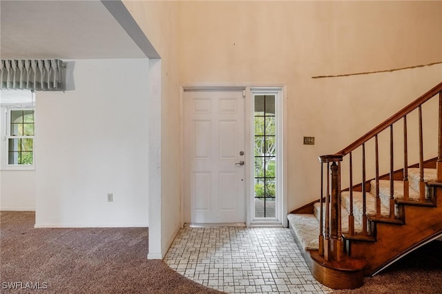 view of carpeted entrance foyer