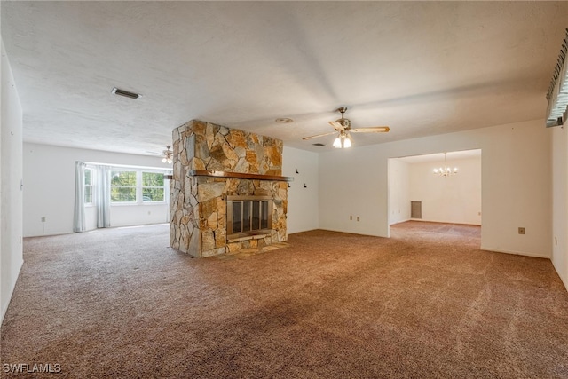 unfurnished living room with a textured ceiling, carpet flooring, ceiling fan with notable chandelier, and a fireplace