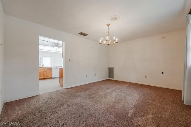 carpeted spare room featuring an inviting chandelier and sink