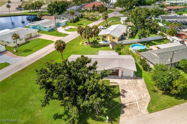 bird's eye view featuring a residential view and a water view