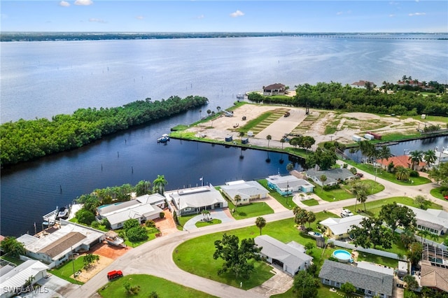 aerial view with a residential view and a water view