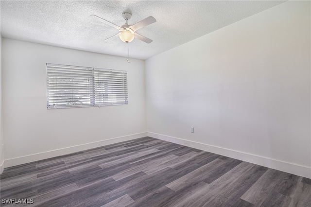 unfurnished room with a textured ceiling, baseboards, dark wood-style flooring, and ceiling fan