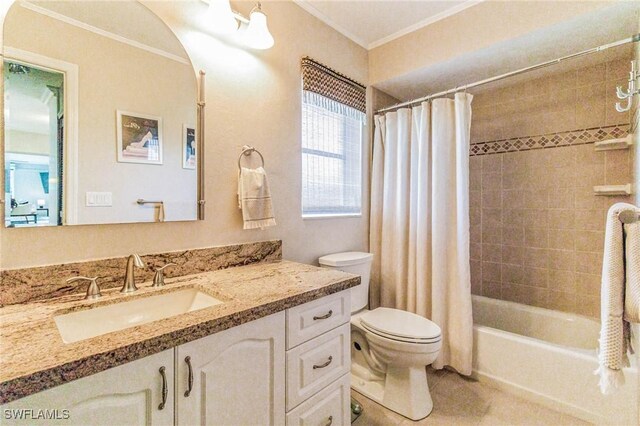 full bathroom featuring shower / tub combo with curtain, vanity, ornamental molding, tile patterned floors, and toilet