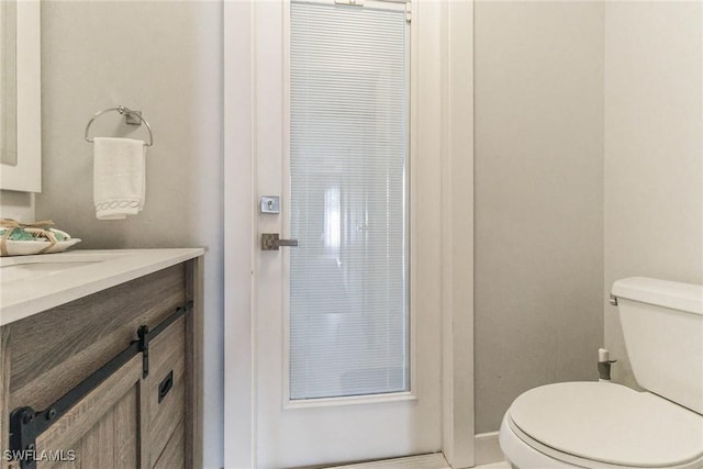 bathroom with vanity and toilet