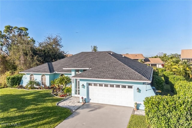 15141 Sam Snead Ln, North Fort Myers, FL 33917 - view of front of property featuring stucco siding, a shingled roof, an attached garage, and a front lawn