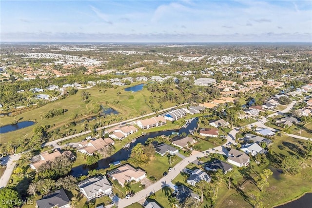 drone / aerial view featuring a residential view and a water view