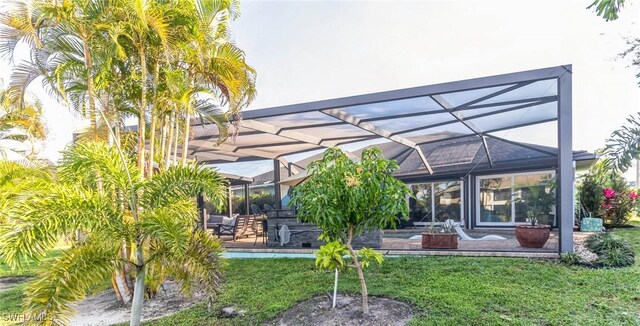 exterior space with a lanai and a patio area