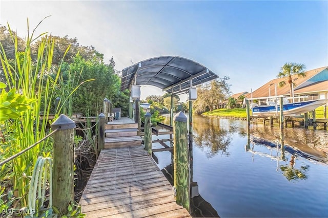 dock area with a water view