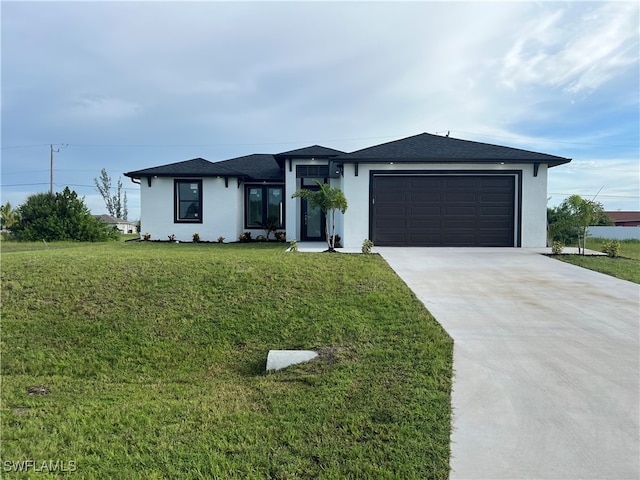 view of front facade featuring a garage and a front yard