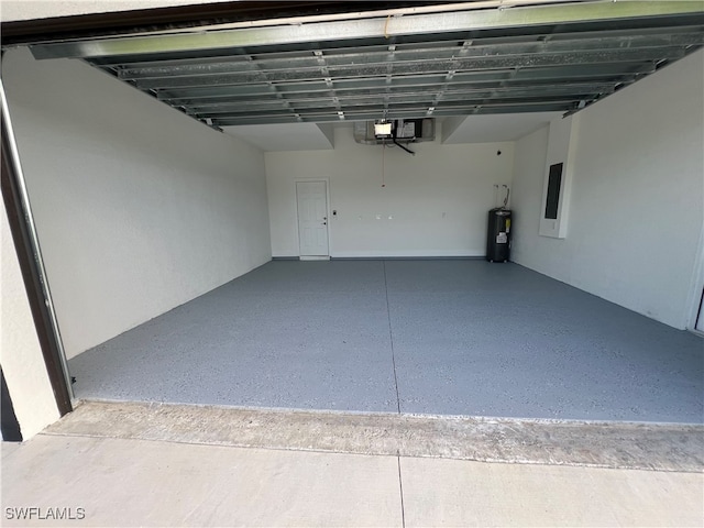 garage featuring electric panel and electric water heater