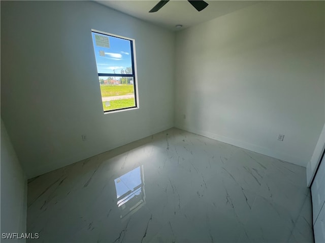 spare room with ceiling fan