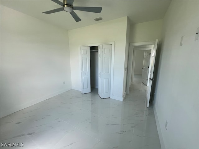 unfurnished bedroom featuring a closet and ceiling fan