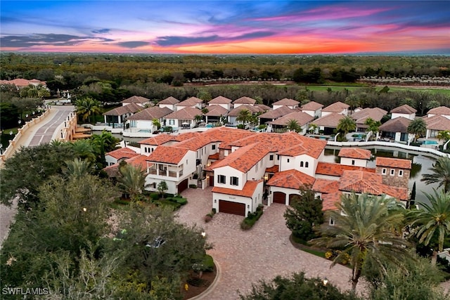 16649 Toscana Cir Unit 803, Naples, FL 34110 - aerial view at dusk featuring a residential view