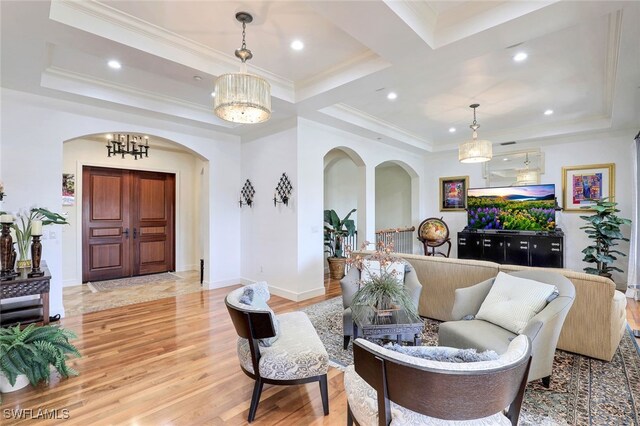 16649 Toscana Cir Unit 803, Naples, FL 34110 - living area with arched walkways, crown molding, light wood-style floors, and recessed lighting