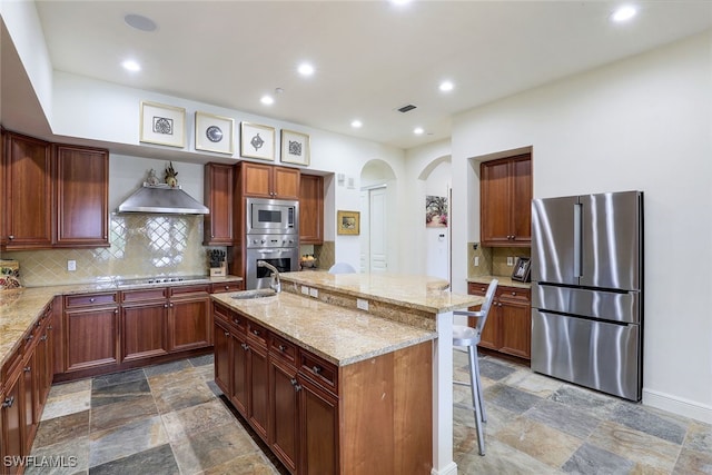 16649 Toscana Cir Unit 803, Naples, FL 34110 - kitchen with a breakfast bar area, light stone countertops, stainless steel appliances, stone finish floor, and visible vents