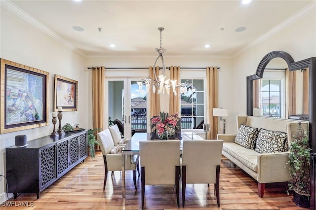 16649 Toscana Cir Unit 803, Naples, FL 34110 - dining area featuring light wood finished floors, a notable chandelier, crown molding, and recessed lighting