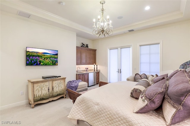 16649 Toscana Cir Unit 803, Naples, FL 34110 - bedroom featuring light colored carpet, a tray ceiling, a chandelier, and crown molding