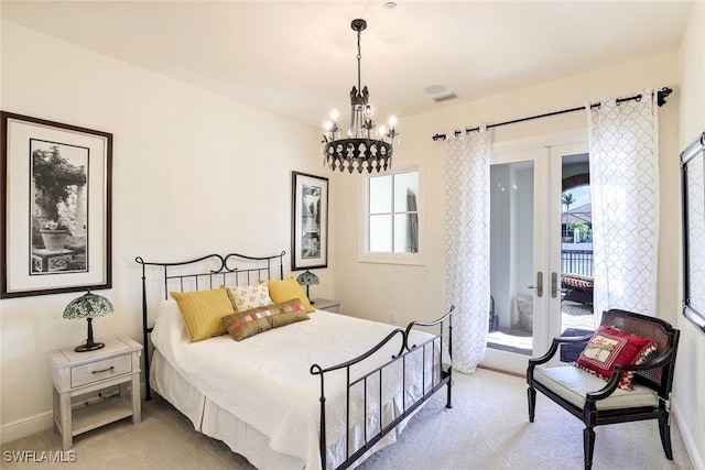 16649 Toscana Cir Unit 803, Naples, FL 34110 - carpeted bedroom featuring french doors, an inviting chandelier, access to exterior, and baseboards