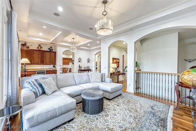 16649 Toscana Cir Unit 803, Naples, FL 34110 - living area featuring arched walkways, wood finished floors, recessed lighting, ornamental molding, and coffered ceiling