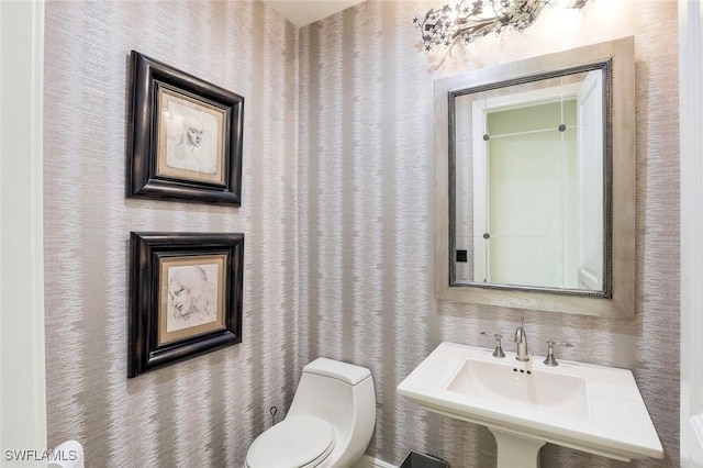 16649 Toscana Cir Unit 803, Naples, FL 34110 - bathroom featuring toilet and a sink