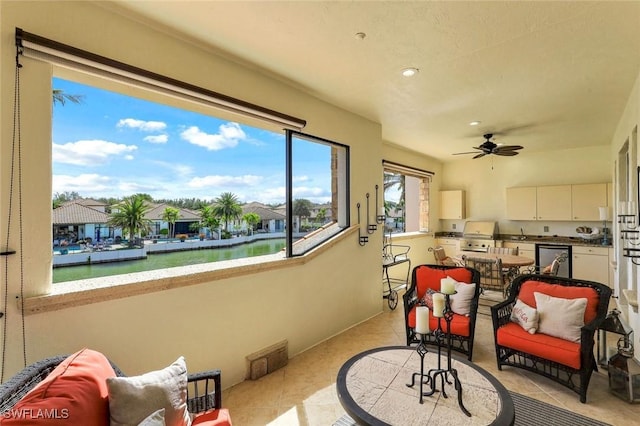 16649 Toscana Cir Unit 803, Naples, FL 34110 - interior space with a water view, an outdoor kitchen, and ceiling fan