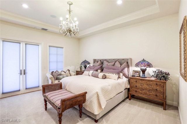 16649 Toscana Cir Unit 803, Naples, FL 34110 - bedroom with a chandelier, ornamental molding, access to outside, a tray ceiling, and light colored carpet