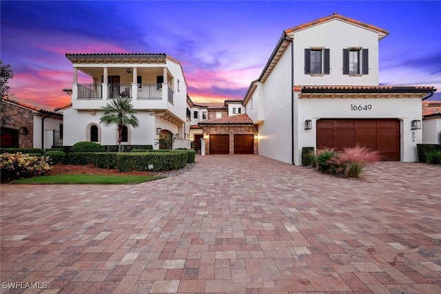 16649 Toscana Cir Unit 803, Naples, FL 34110 - mediterranean / spanish house featuring a garage, a balcony, and stucco siding