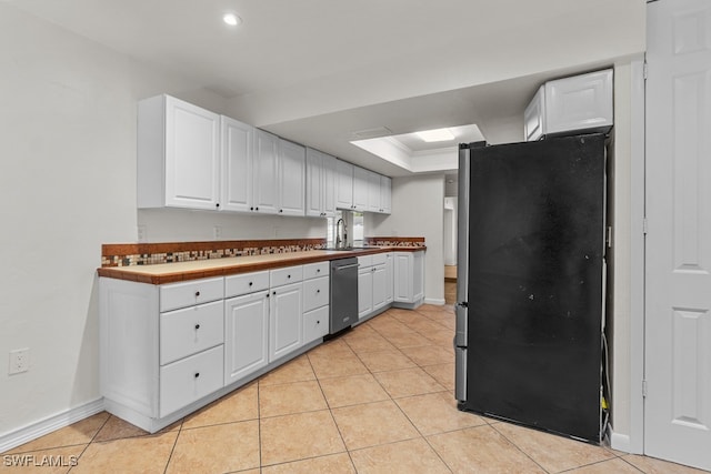 kitchen with sink, a raised ceiling, white cabinets, and appliances with stainless steel finishes