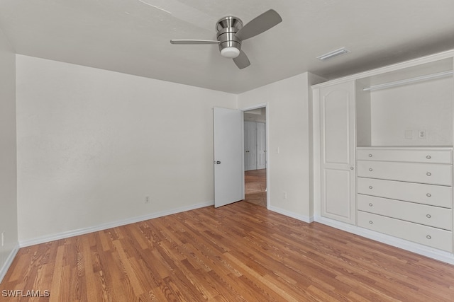 unfurnished bedroom with ceiling fan and light wood-type flooring