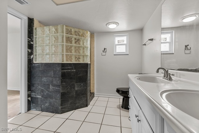 bathroom with vanity, walk in shower, toilet, tile patterned floors, and a textured ceiling