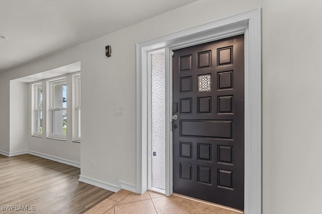 entrance foyer with light tile patterned floors