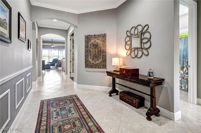 hall featuring ornamental molding