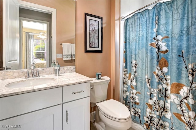 bathroom with vanity and toilet