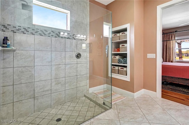 bathroom featuring tile patterned floors and tiled shower