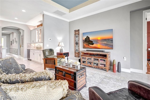 tiled living room featuring ornamental molding and wine cooler